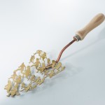 A trowel face is made up of the silhouettes of the family from the immigrant crossing sign on a white background