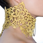 Metal lace high collar with hinged back and fabricated needle front clasp with freshwater pearl chain.
