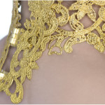 Metal lace collar, rear view of hinged mechanism on a female in profile on a white background.